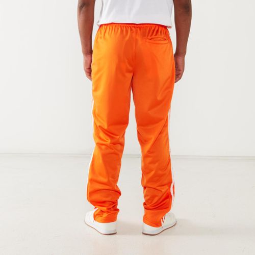 orange adidas track pants